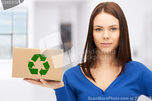 Image of attractive businesswoman with recyclable box