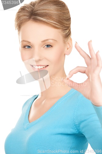 Image of young woman showing ok sign