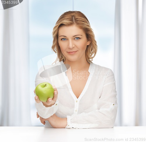 Image of woman with green apple