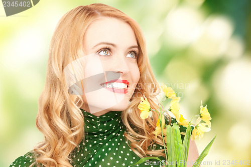 Image of lovely housewife with flower