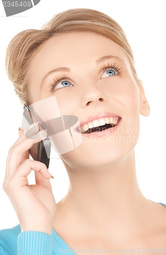 Image of businesswoman with cell phone calling