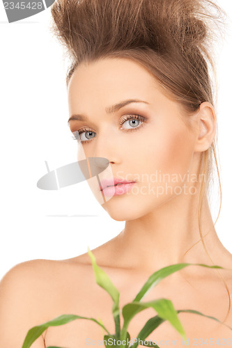 Image of woman with green sprout