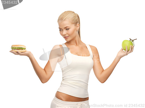 Image of woman with apple and hamburger