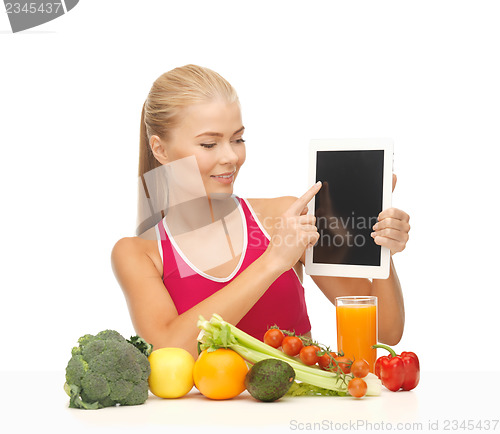 Image of woman with fruits, vegetables and tablet pc