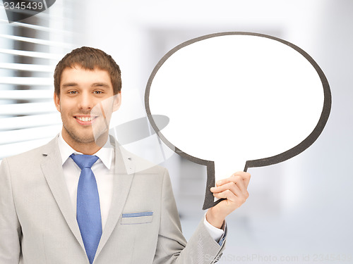 Image of smiling businessman with blank text bubble