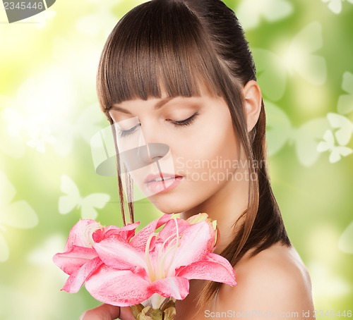 Image of woman with lily flower and butterflies