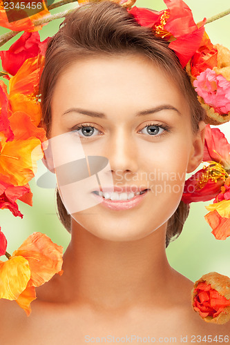 Image of lovely woman with red flowers
