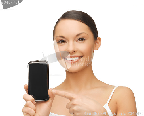 Image of woman pointing at smartphone with sport app