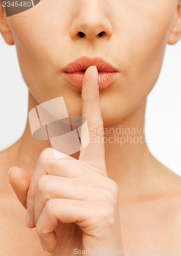 Image of woman making a hush gesture