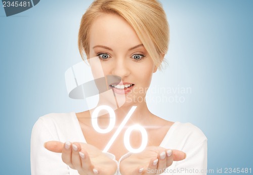 Image of woman showing sign of percent in her hands