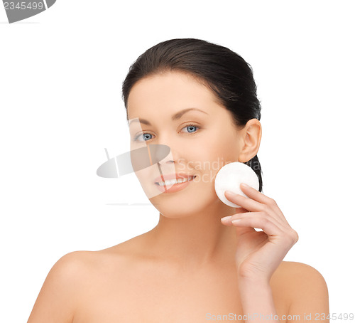 Image of beautiful woman with cotton pad