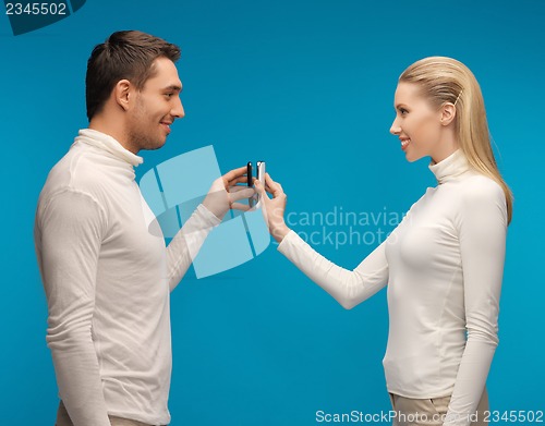 Image of man and woman with modern gadgets