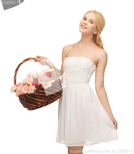 Image of woman with basket full of flowers
