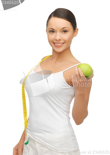 Image of woman with measuring tape and apple