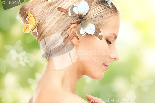 Image of woman with butterflies in hair