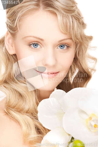 Image of lovely woman with orchid flower