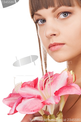 Image of lovely woman with lily flower