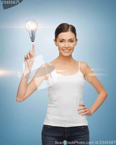 Image of woman pointing her finger at light bulb