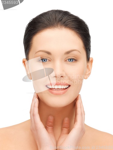 Image of face and hands of beautiful woman