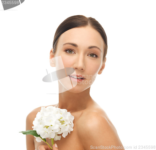 Image of beautiful woman with white flower