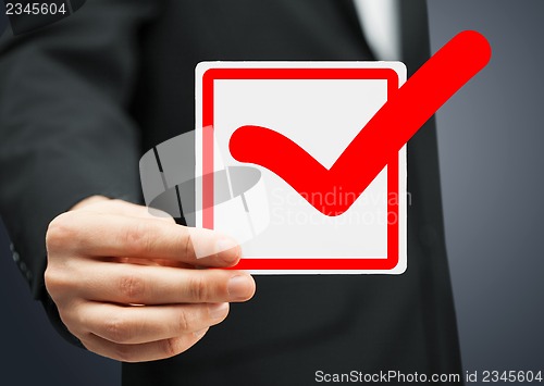 Image of closeup of checkbox and red mark in it