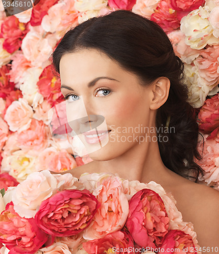 Image of woman with background full of roses