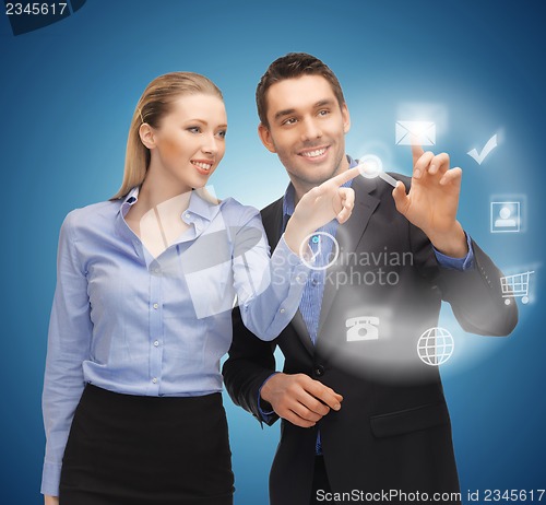 Image of man and woman working with virtual screen