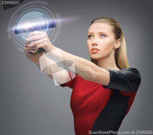 Image of futuristic woman with gadget