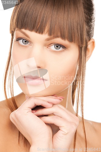 Image of face and hands of beautiful woman