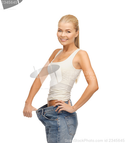 Image of sporty woman showing big pants