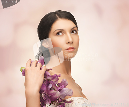 Image of relaxed woman with flowers