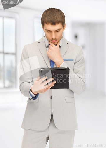 Image of calm man with tablet pc computer