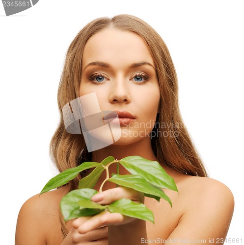 Image of woman with green leaf