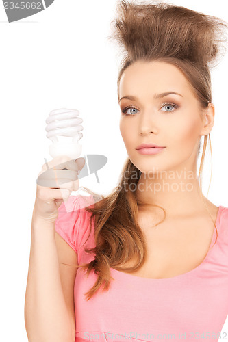 Image of woman with energy saving bulb