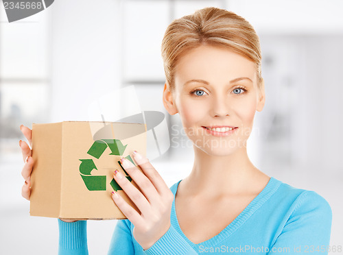 Image of woman with recyclable box