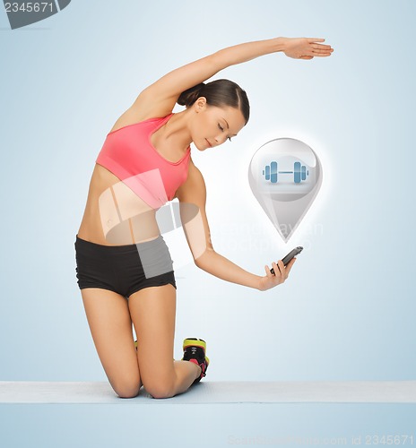 Image of beautiful sporty woman doing exercise