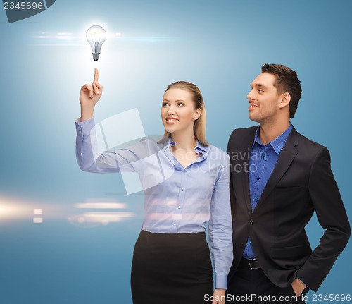 Image of man and woman with light bulb