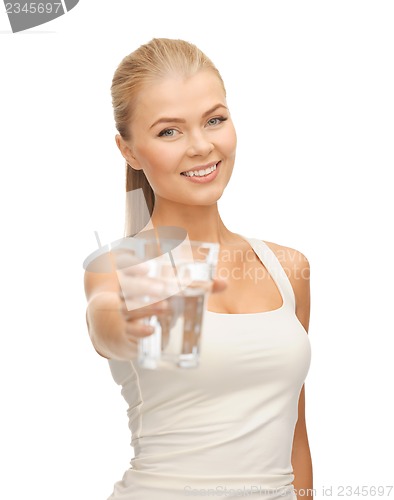 Image of young smiling woman with glass of water