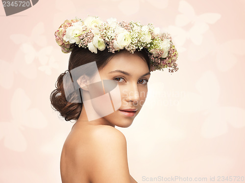 Image of woman wearing wreath of flowers