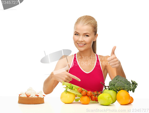 Image of woman pointing at healthy food