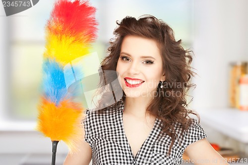 Image of beautiful woman with cleaning sweep