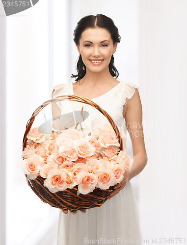 Image of woman with basket full of flowers