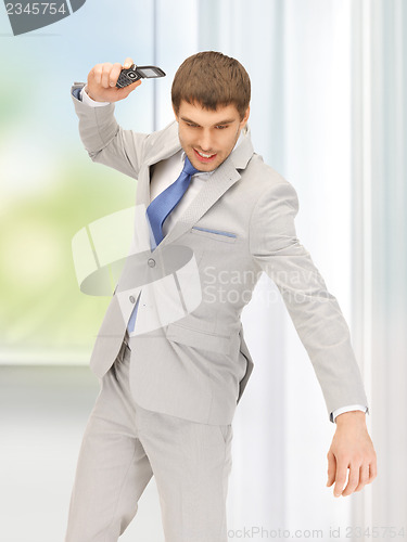 Image of angry man with cell phone