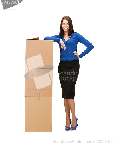 Image of businesswoman with big carton boxes