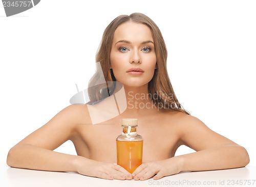Image of woman with oil bottle