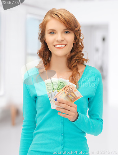 Image of happy teenage girl with euro cash money