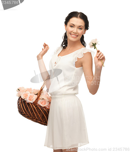 Image of woman with basket full of flowers