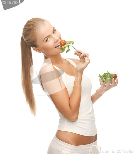 Image of healthy woman holding bowl with salad