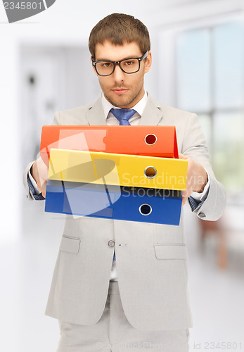 Image of man with folders