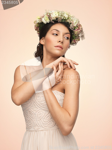 Image of woman wearing wreath of flowers